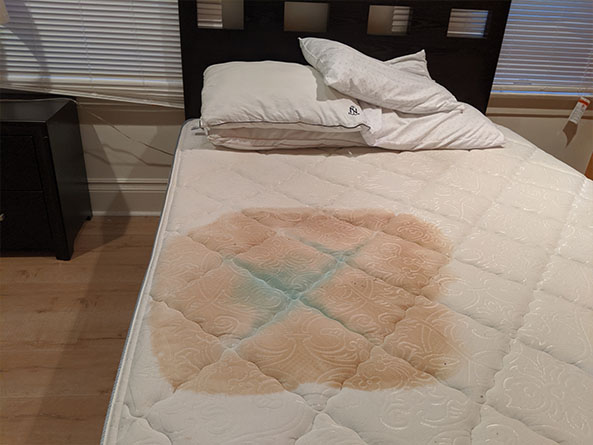 What is this giant stain on the mattress of this vacation rental?